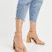When worn with a skirt or dress, high heels sandals can heighten the wearer’s stature while also drawing attention to their legs’ strong muscles