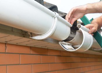 End piece of a gutter section that keeps stray debris or water from flowing out of the guttering