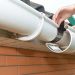 End piece of a gutter section that keeps stray debris or water from flowing out of the guttering