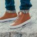 How should men dress with casual sneakers?