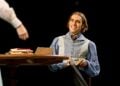 Seamus Dillane performing in a wide Arcadia stage scene