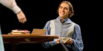 Seamus Dillane performing in a wide Arcadia stage scene
