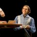 Seamus Dillane performing in a wide Arcadia stage scene