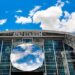 AT&T Stadium exterior and glass roof viewed from the surrounding grounds