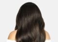 Long dark wavy hair showing a voluminous Cliphair extension style
