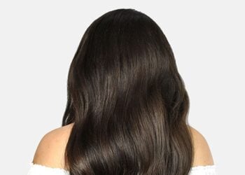 Long dark wavy hair showing a voluminous Cliphair extension style