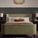 Charlotte upholstered bed styled in a calm bedroom setting
