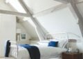 Oliver metal bed styled in a light bedroom