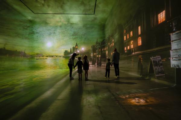 Family enjoying a day out in FRAMELESS immersive galleries