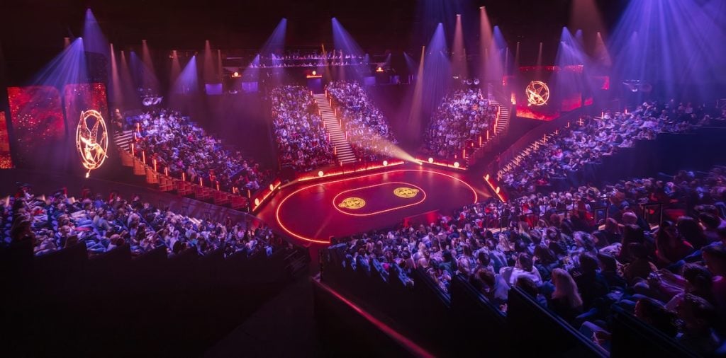 A cinematic arena scene from The Hunger Games on Stage
