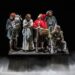 Into the Woods performers on a dark theatrical stage