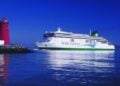 Irish Ferries ferry sailing near a lighthouse