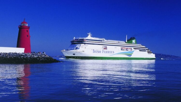 Irish Ferries ferry sailing near a lighthouse