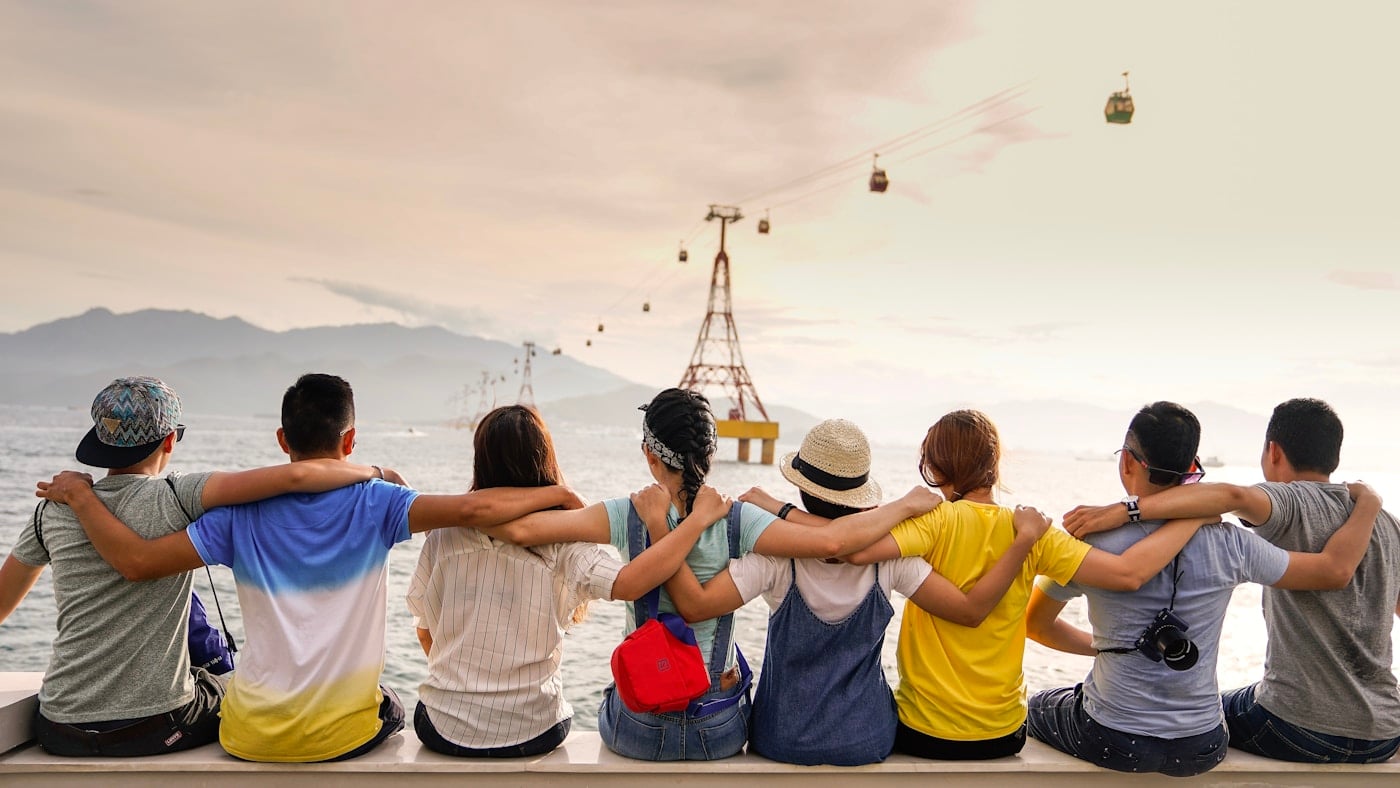 Friends planning a trip together at a table