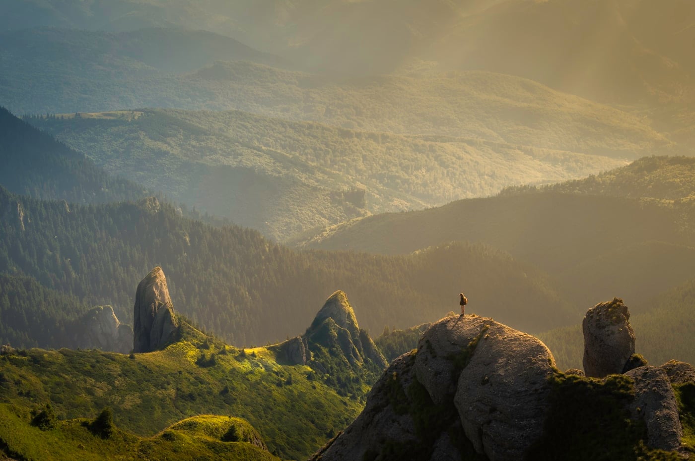 Hiker standing at a mountain overlook