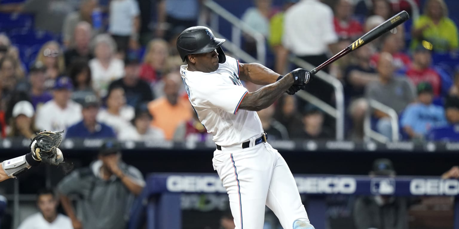 Miami Marlins player batting under the lights at loanDepot Park