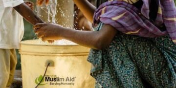 Family receiving clean water support through Muslim Aid