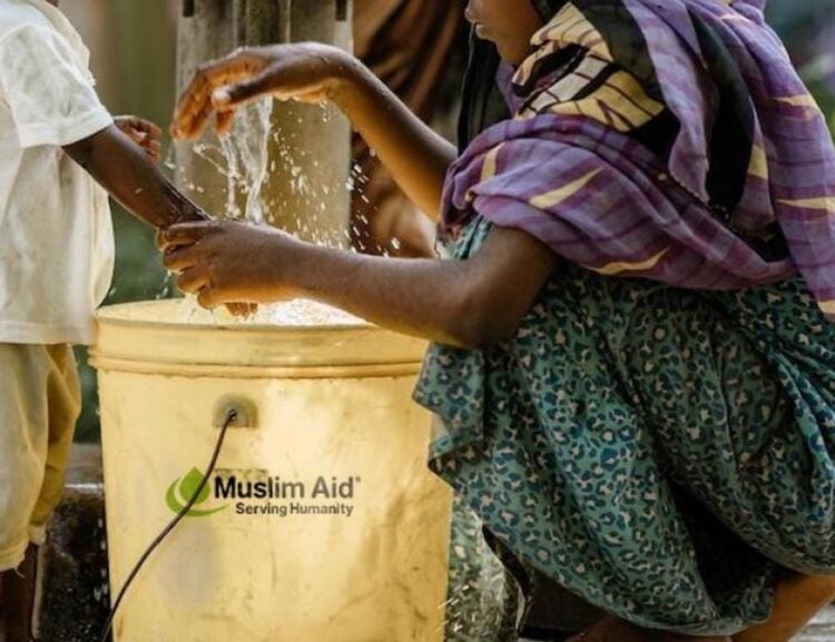 Family receiving clean water support through Muslim Aid