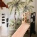 Playroom with jungle wall mural and a white slide