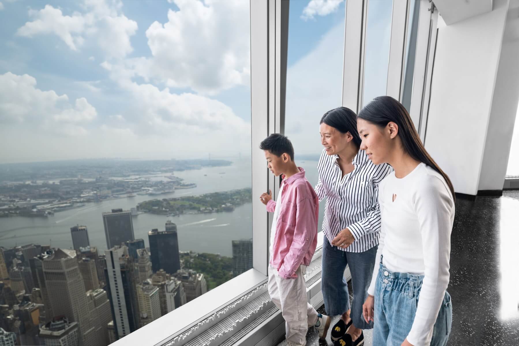 Family enjoying the observation deck view over New York City