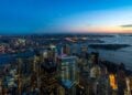 Wide sunset panorama of New York Harbor and Lower Manhattan from above