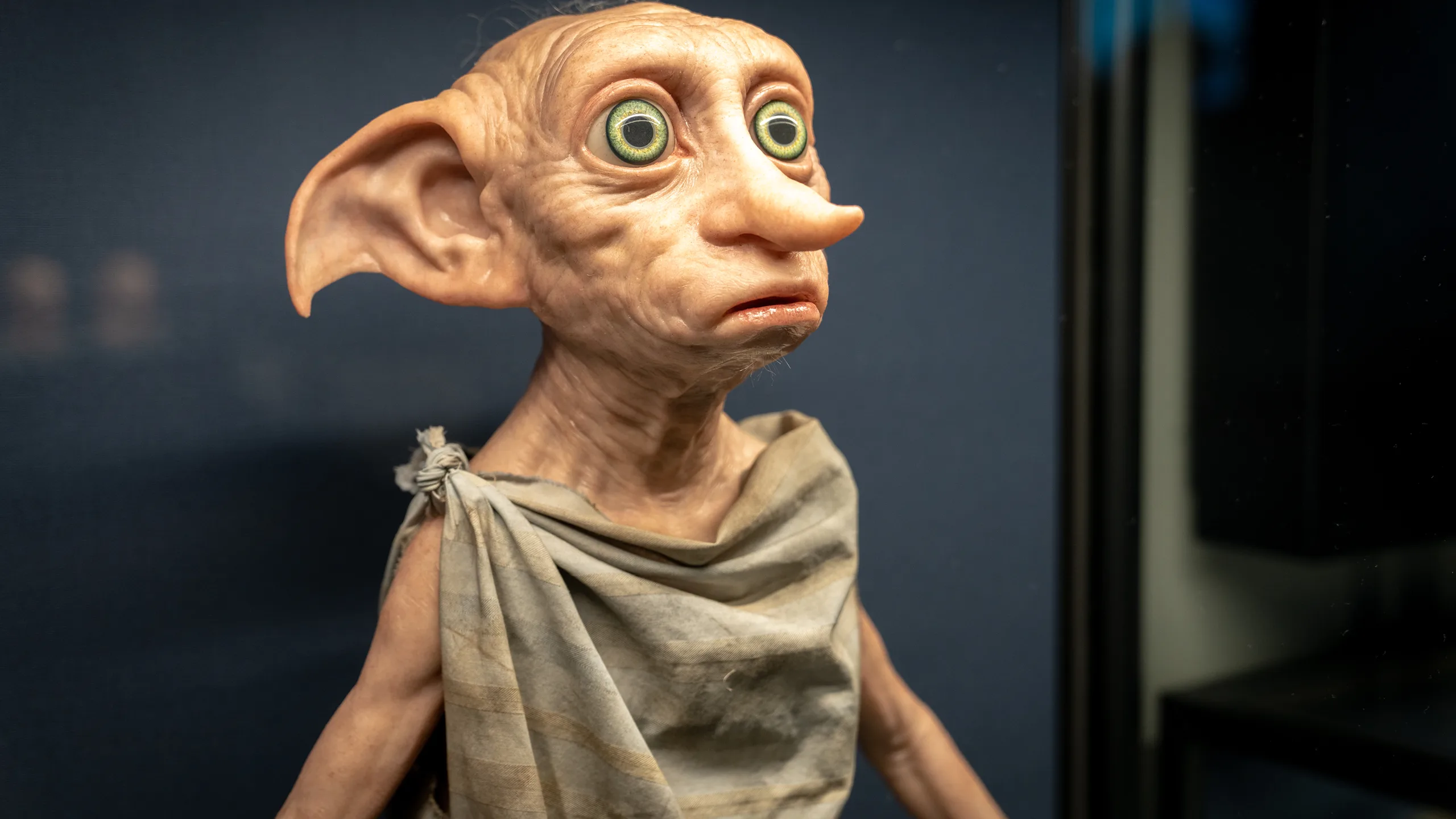 A Dobby figure displayed in a Harry Potter film-making set