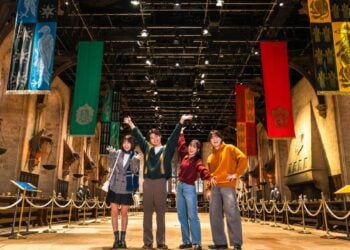 Visitors experiencing the Great Hall set at Warner Bros. Studios Japan