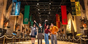 Visitors experiencing the Great Hall set at Warner Bros. Studios Japan