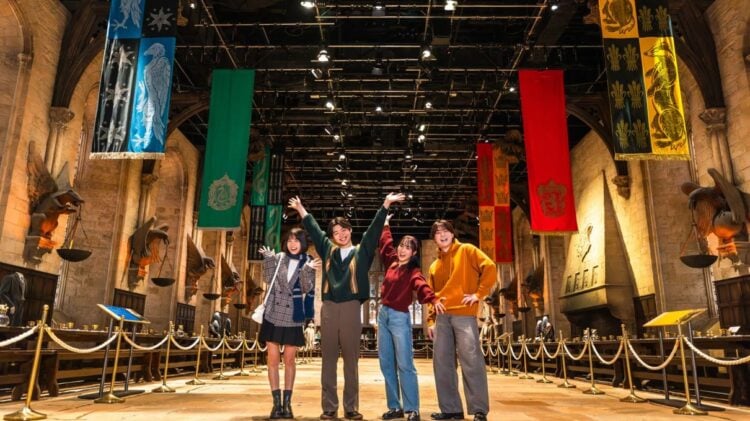 Visitors experiencing the Great Hall set at Warner Bros. Studios Japan