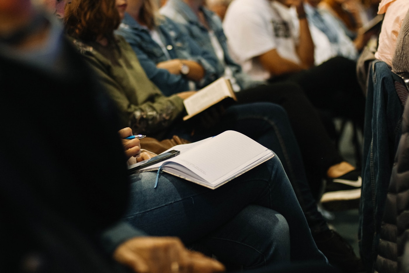 People taking notes indoors while planning