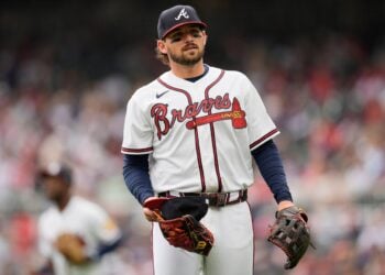 Atlanta Braves player standing ready on a baseball field
