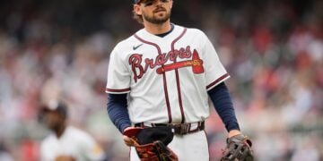 Atlanta Braves player standing ready on a baseball field