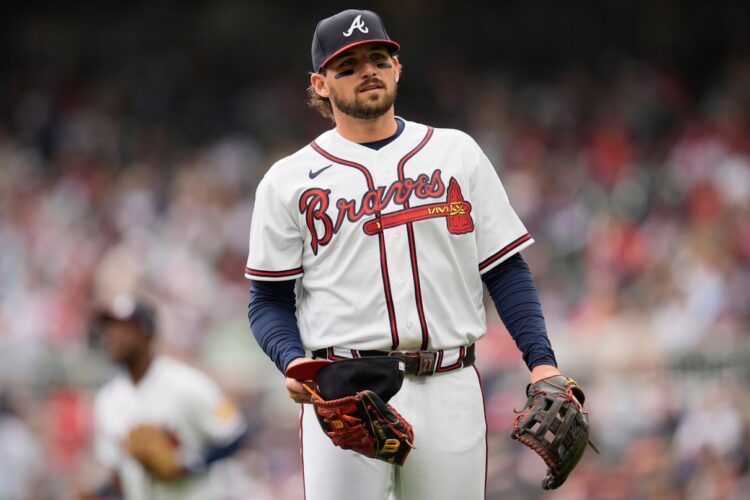 Atlanta Braves player standing ready on a baseball field