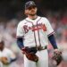 Atlanta Braves player standing ready on a baseball field