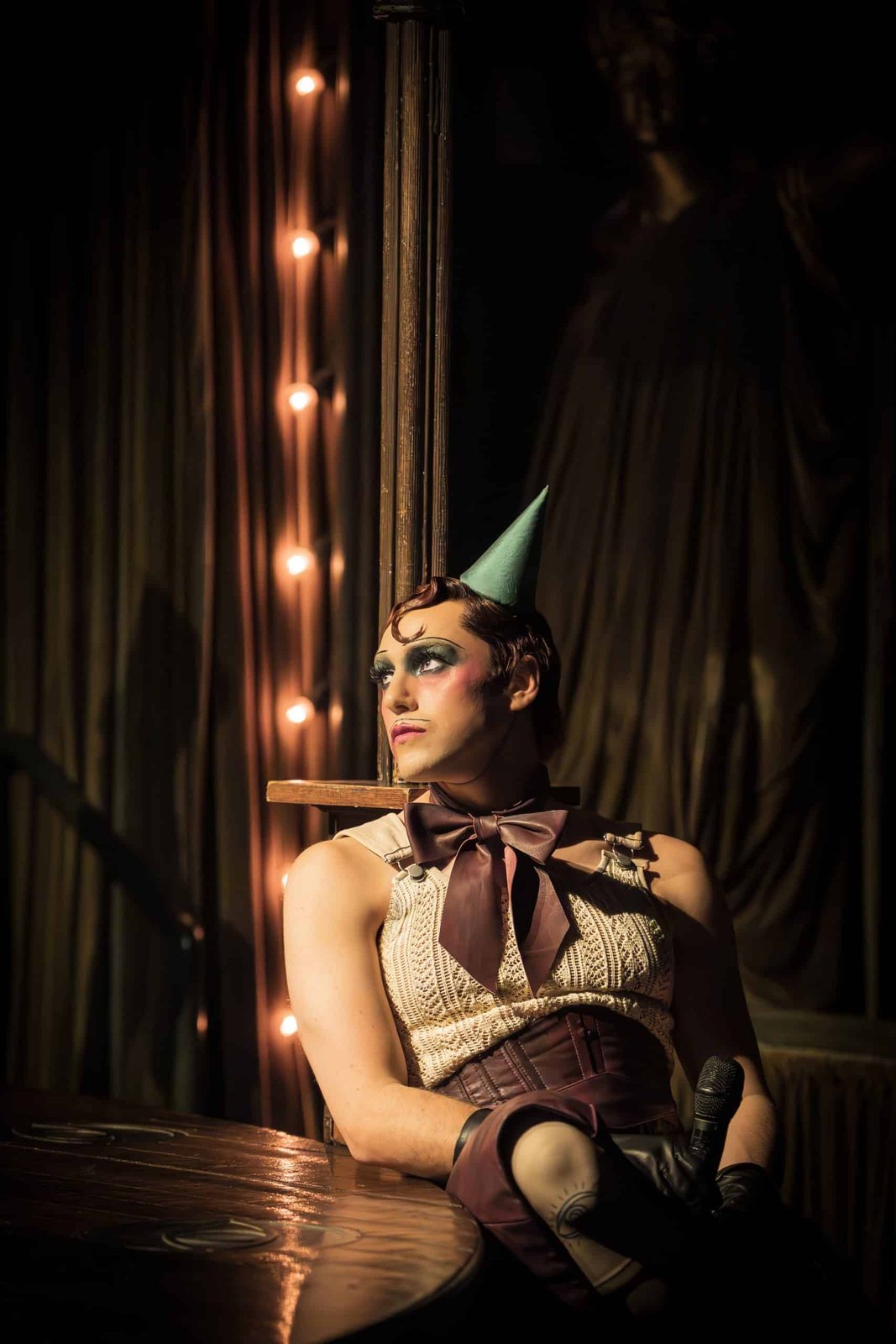 Cabaret stage performance under club lighting