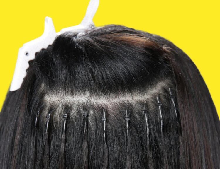 Nano ring hair extensions shown in use in styled hair