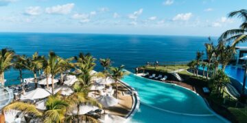 Tropical resort pool and palm trees