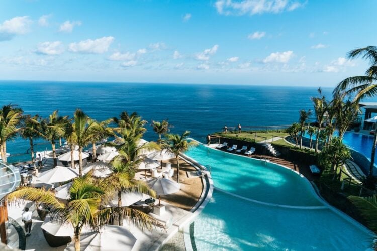 Tropical resort pool and palm trees
