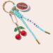 Cocofloss Cherry Bloom floss and matching bag charm