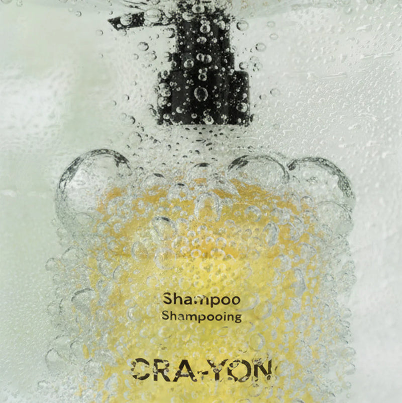 Sand Service shampoo-flaska under rinnande vatten
