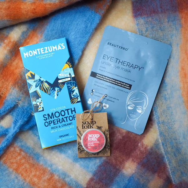 Get Well gift scene with chocolate, an eye mask and soap from Don't buy her flowers