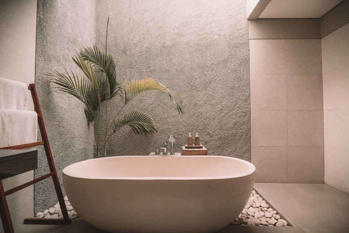 Modern bathroom vanity with a round mirror and basin