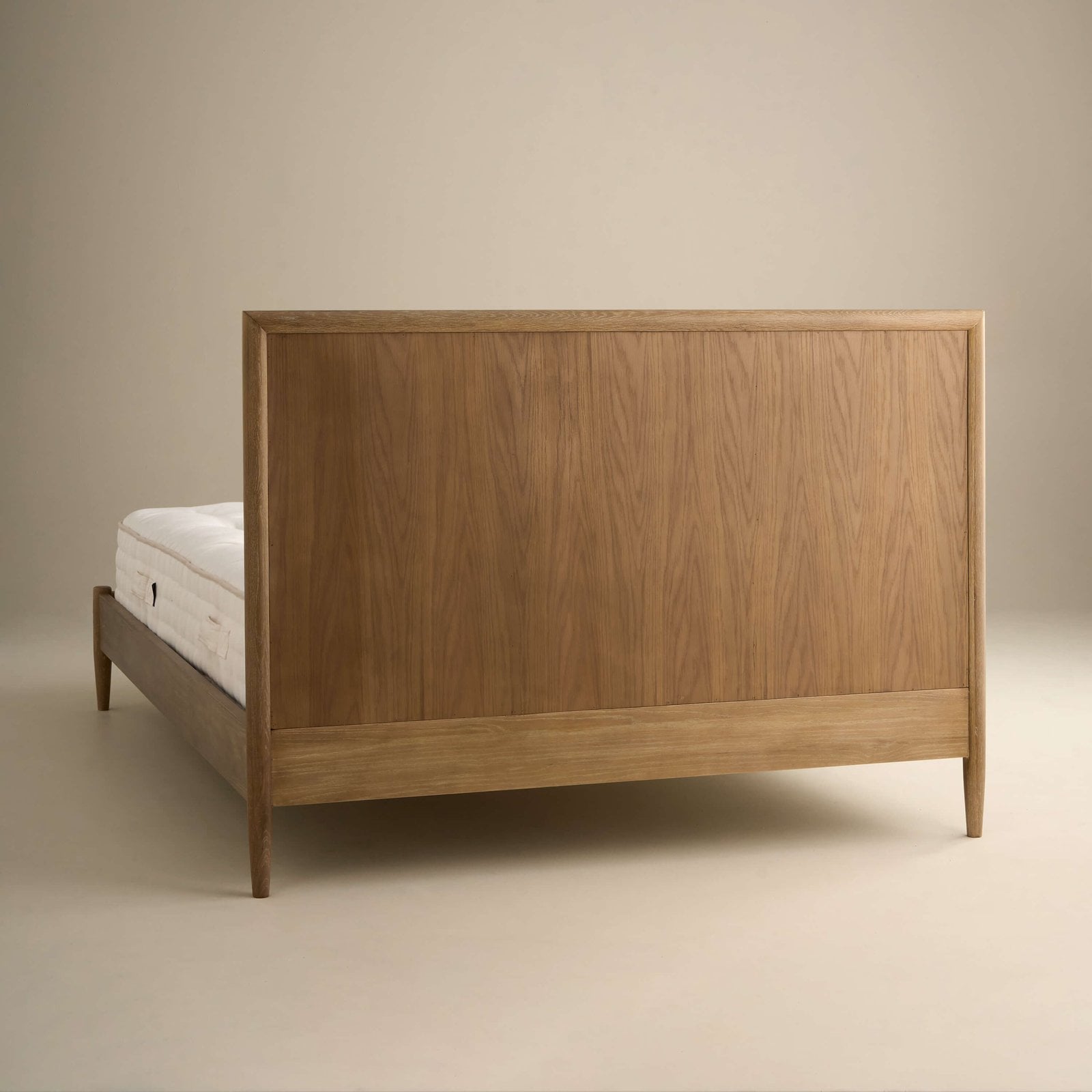 Headboard detail of the Adina Bed in weathered oak
