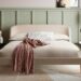 Cambourne upholstered king bed in latte bouclé with curved headboard