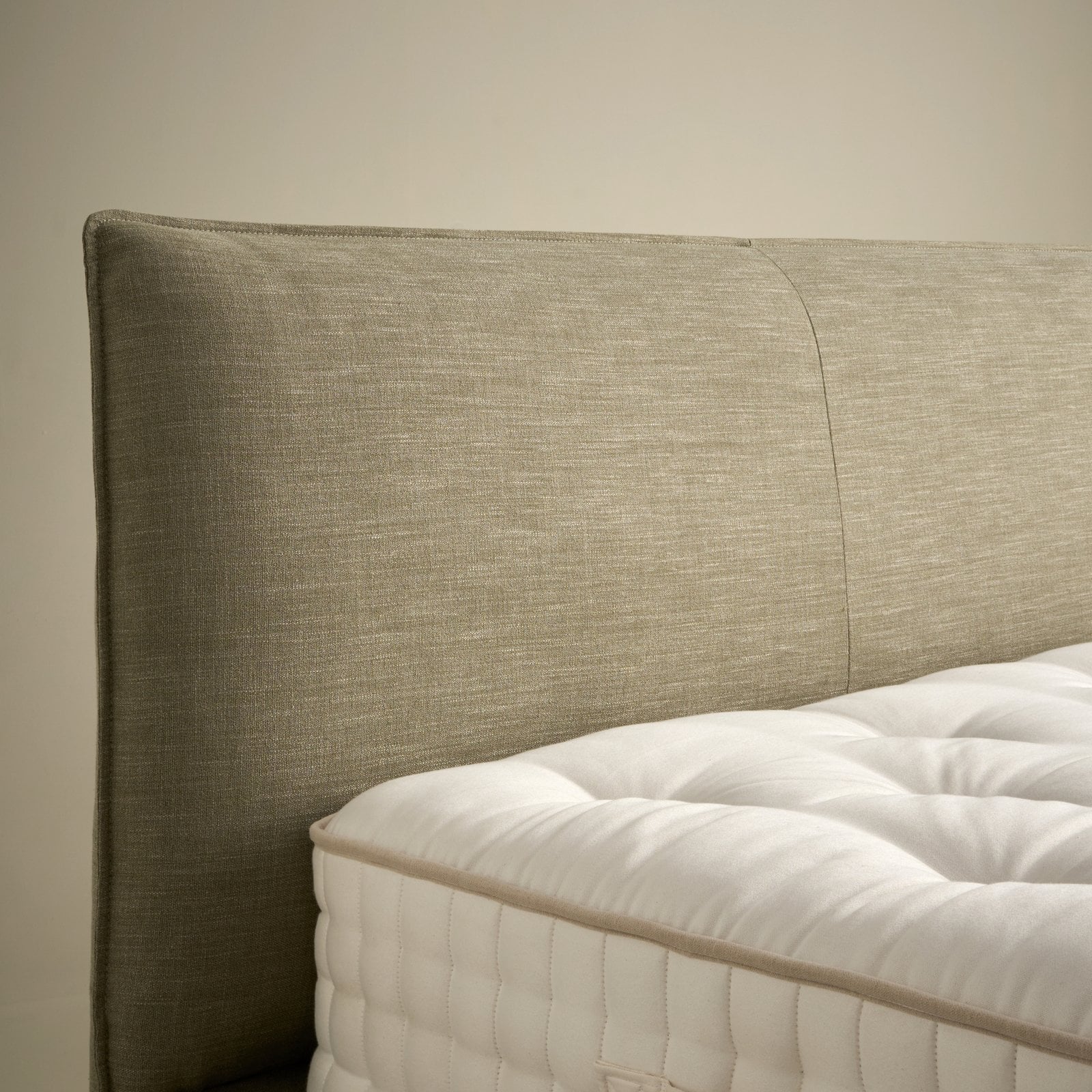 Side detail of the Orla Side Opening Ottoman Bed in olive fabric