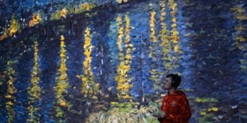 A visitor-facing immersive gallery scene with Van Gogh artwork projected across the walls at Frameless