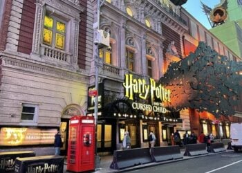 Lyric Theatre marquee glowing at dusk for Harry Potter and the Cursed Child