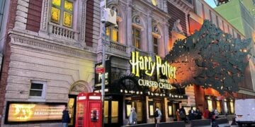 Lyric Theatre marquee glowing at dusk for Harry Potter and the Cursed Child
