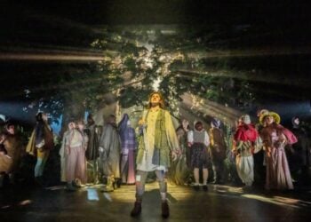 Ensemble on the forest stage in Into the Woods