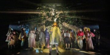Ensemble on the forest stage in Into the Woods